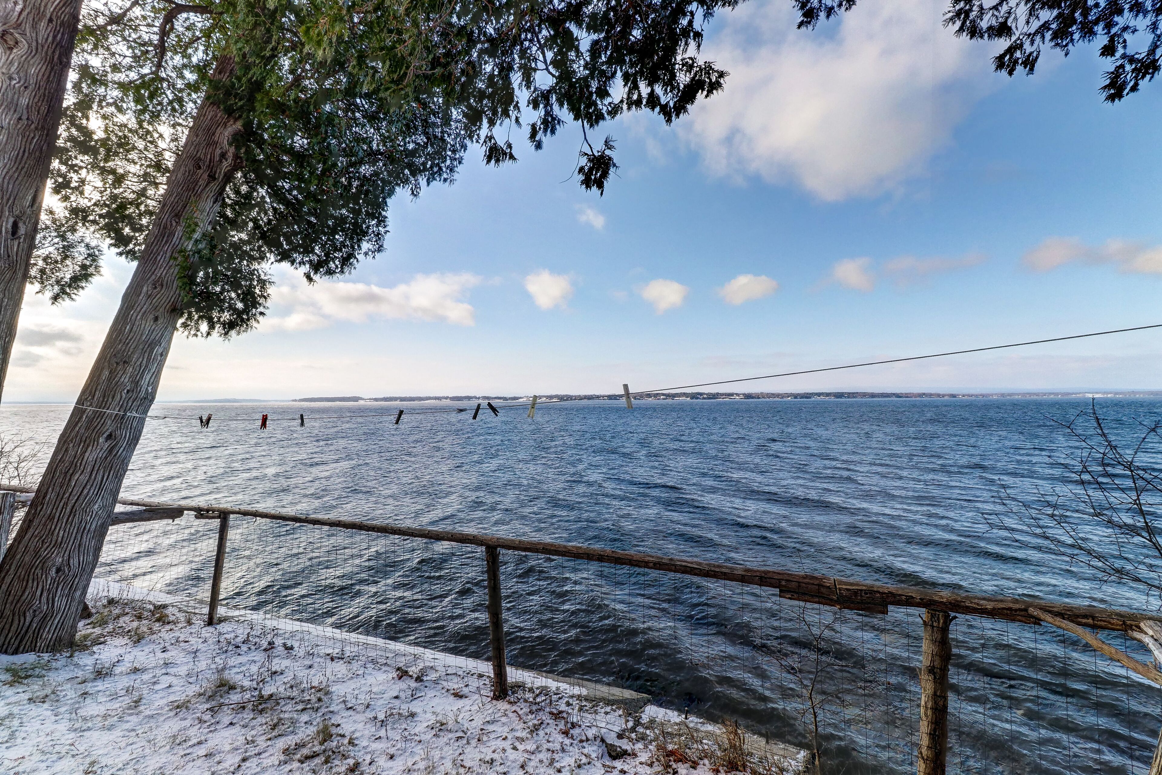 Rustic lakefront home with big porch, WiFi & easy water access