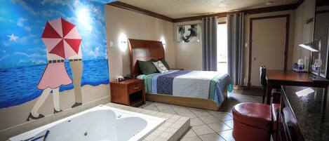 A hotel room with a large bed, a separate bathroom with a bathtub, a ceiling mural, and a window with curtains.