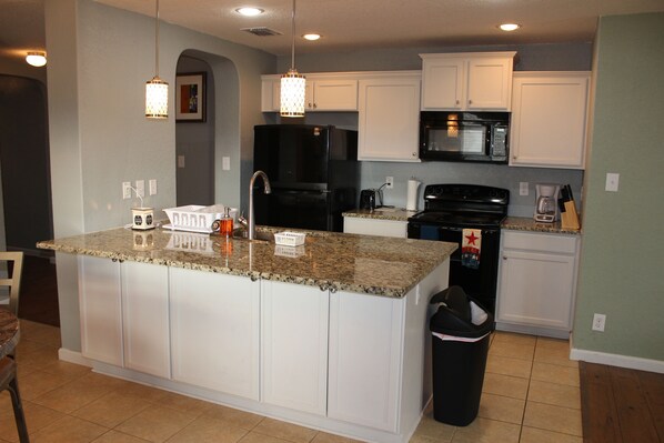 Microwave, dishwasher, coffee/tea maker, cookware/dishes/utensils