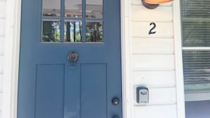 A blue door with a window, a number '2' on the wall, and a security keypad. - 1 bed/1 bath, 1.5 blocks to beach/town, dog friendly (Union Pier)