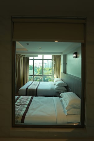 Premier Family Room | Minibar, in-room safe, desk, blackout drapes