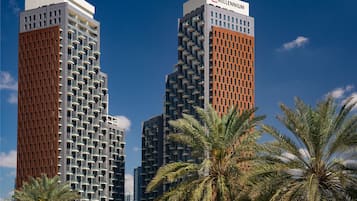 Two high-rise buildings with balconies, one labeled "Millennium."