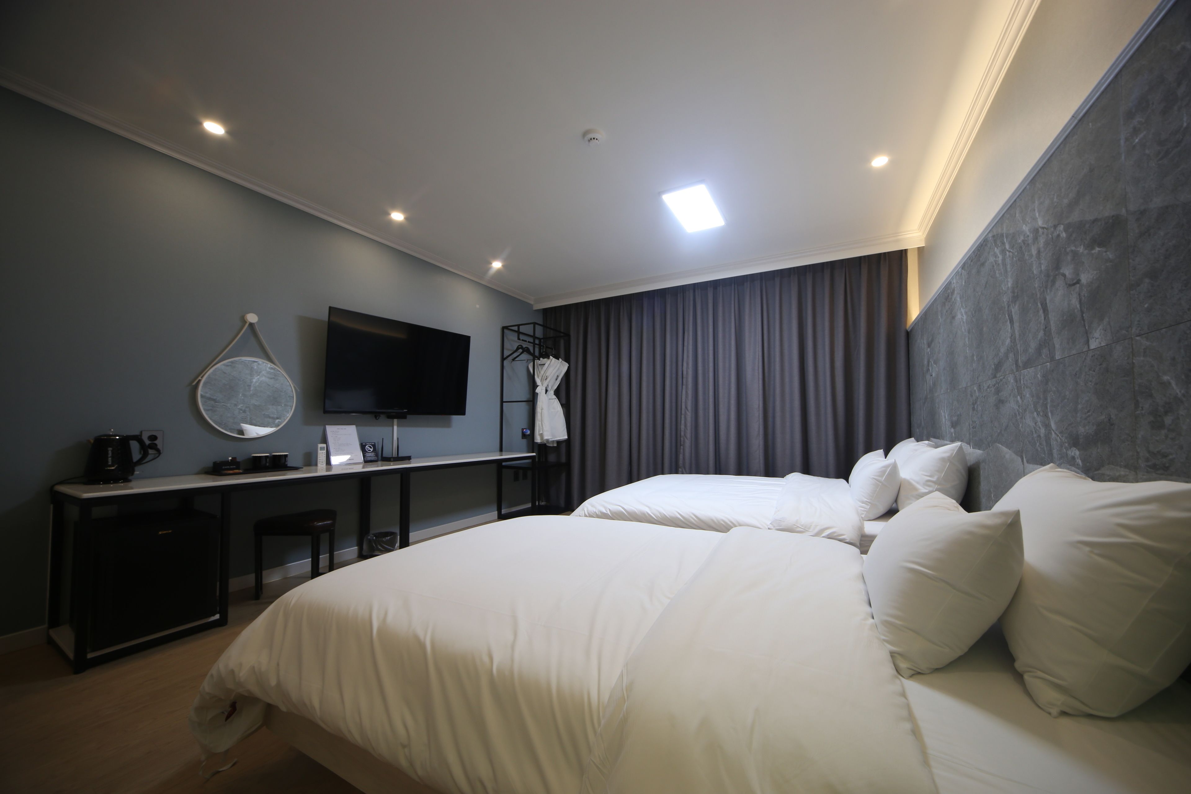 deluxe twin room | desk, laptop workspace, blackout curtains, soundproofing