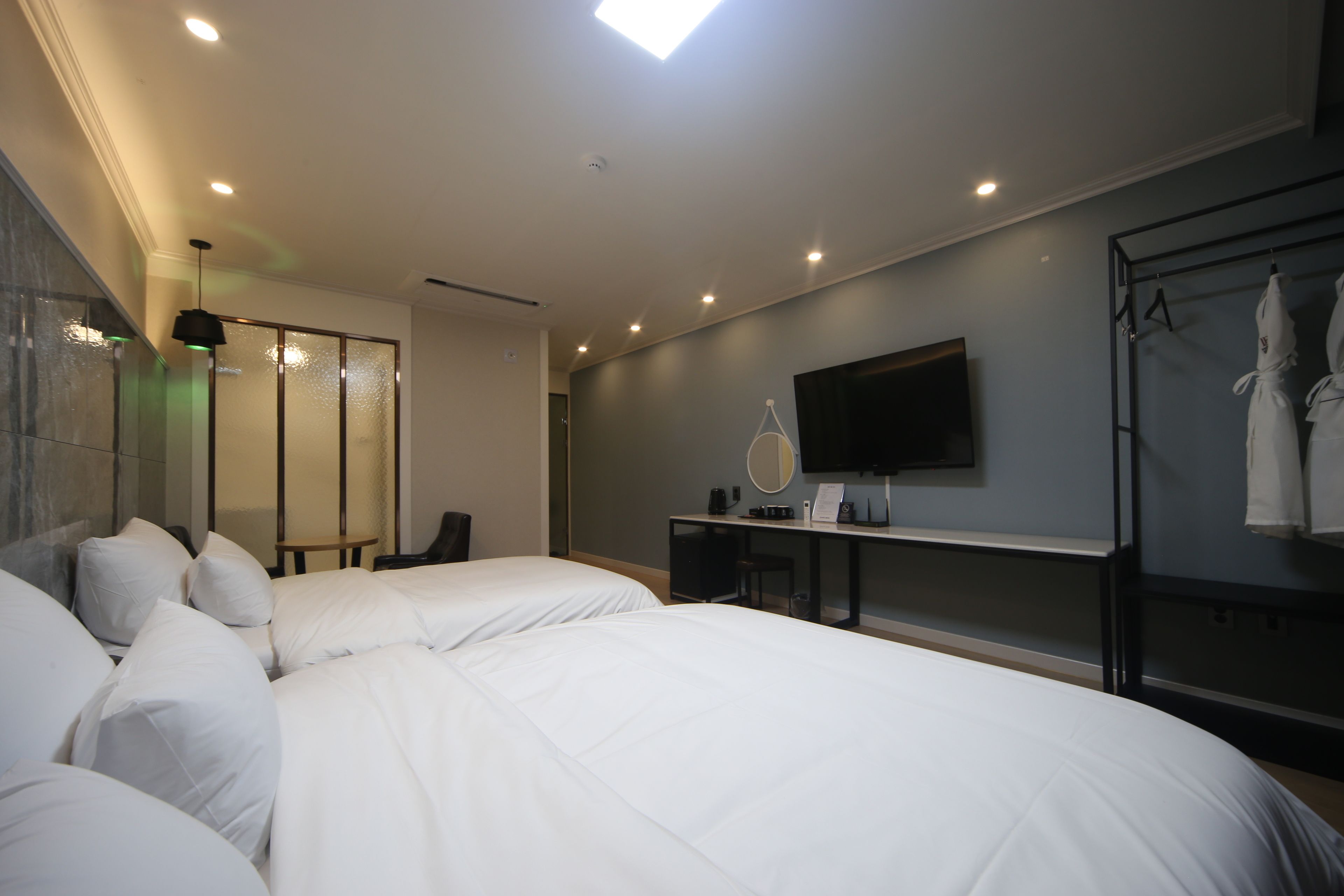 deluxe twin room | desk, laptop workspace, blackout curtains, soundproofing