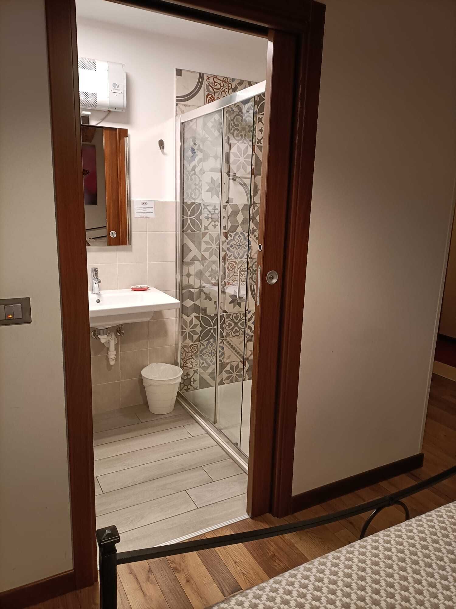 shower, hair dryer, slippers, bidet