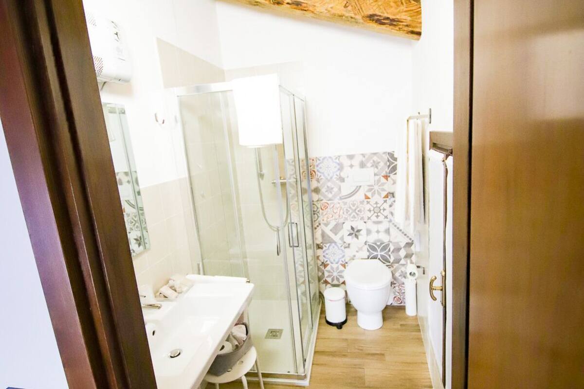 shower, hair dryer, slippers, bidet