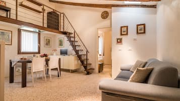 Appartement, 1 chambre | Coin séjour | Télévision à écran plat