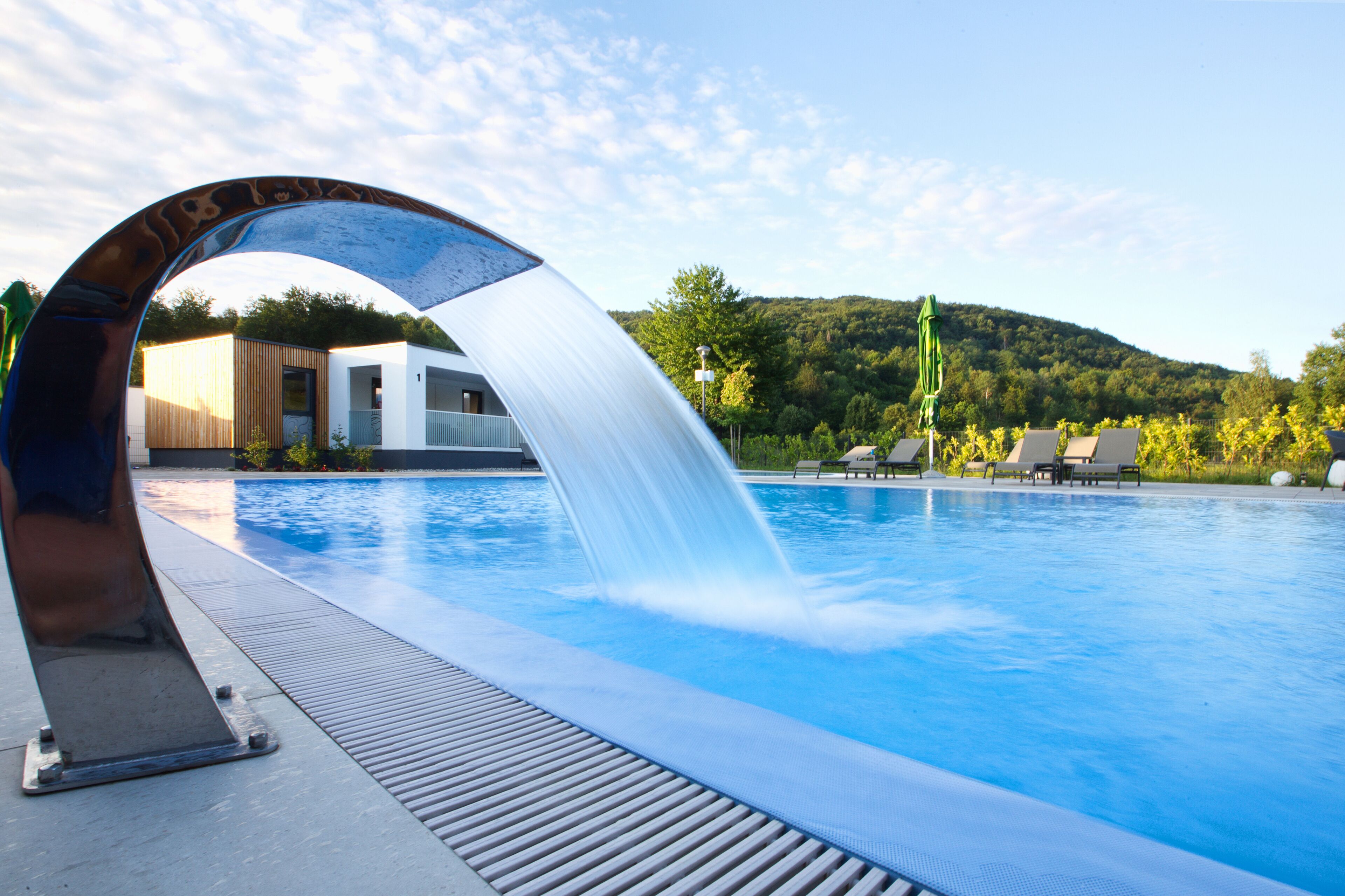 Outdoor pool, pool umbrellas, sun loungers
