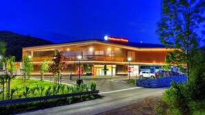 A modern building with a prominent sign reading "Restaurant Plischka". - Mobile Homes Camping Plitvice (Plitvicka Jezera)
