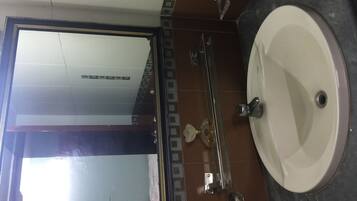 Shower, rainfall showerhead, slippers, towels