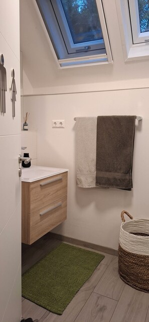 Hair dryer, towels, soap, shampoo