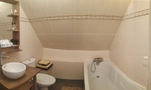 Bathtub, hair dryer, towels, soap