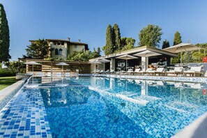 Outdoor pool, open 8:00 AM to 8:00 PM, pool umbrellas, pool loungers
