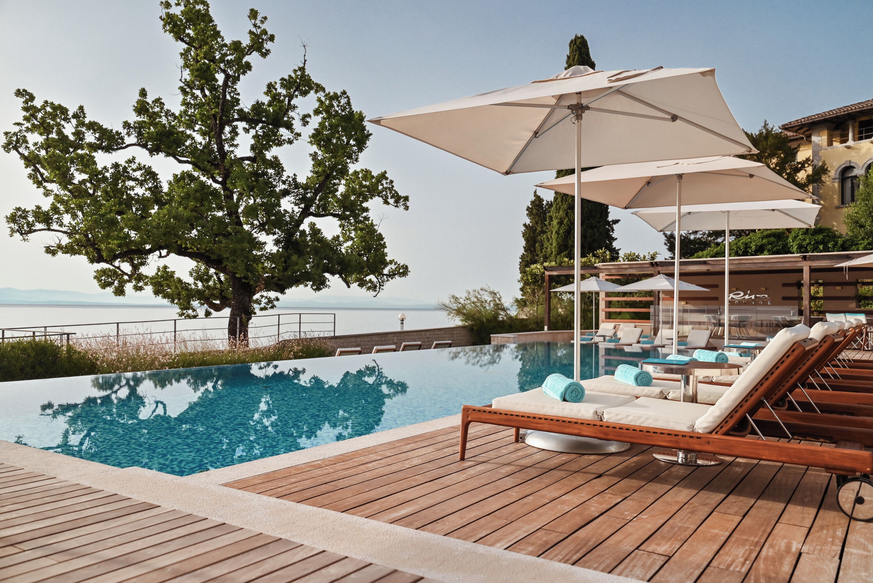 outdoor pool, open 8:00 am to 8:00 pm, pool umbrellas, pool loungers