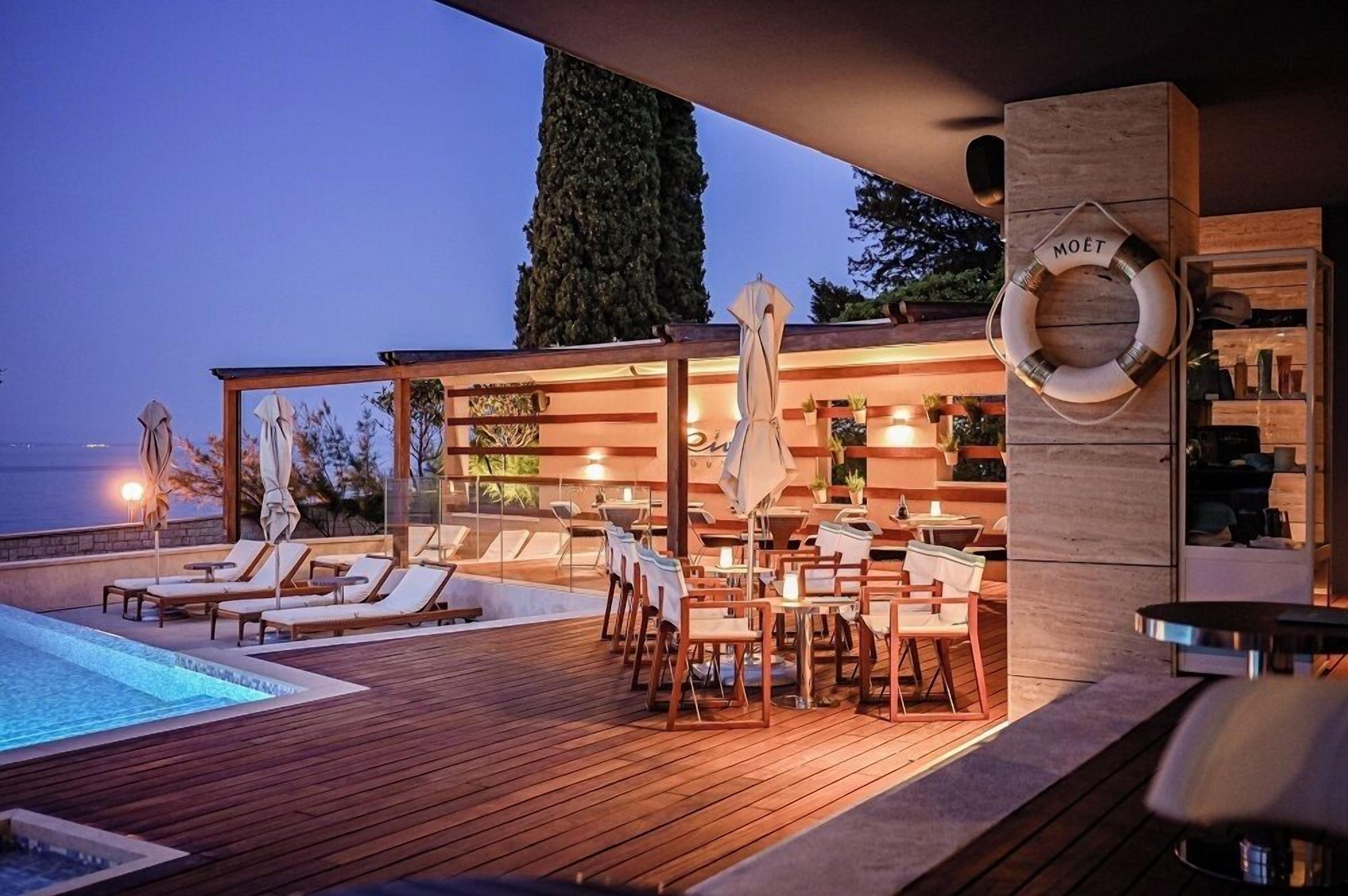 outdoor pool, open 8:00 am to 8:00 pm, pool umbrellas, pool loungers