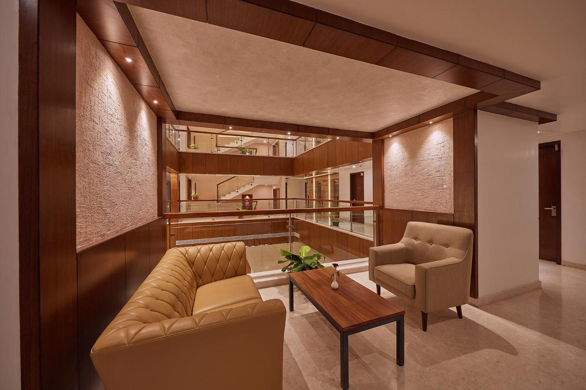 A modern interior with a sofa, armchair, and a coffee table.