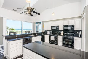 Deluxe Studio Suite, 1 King Bed, Accessible, Ocean View | Private kitchen | Full-size fridge, microwave, oven, stovetop - Three in One  Beach  Home (Melbourne Beach)