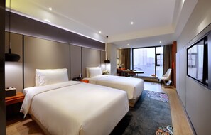 A hotel room with two beds, a desk, a chair, and a large window with a city view. - Atour S Hotel Tai Koo Li Chengdu (Chengdu)