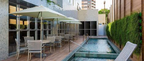 Outdoor pool, open 10:00 AM to 8:00 PM, pool umbrellas, pool loungers