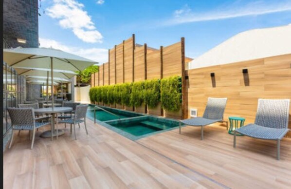 Outdoor pool, open 10:00 AM to 8:00 PM, pool umbrellas, sun loungers