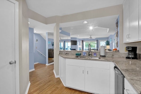 Enjoy cooking in this well-equipped kitchen with a dishwasher and coffee station.