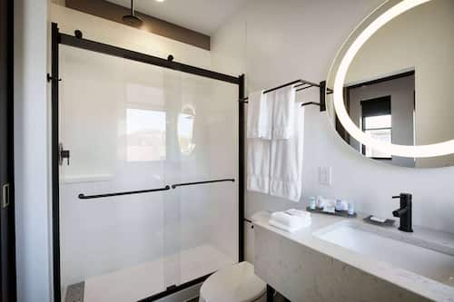Designer toiletries, hair dryer, towels, soap
