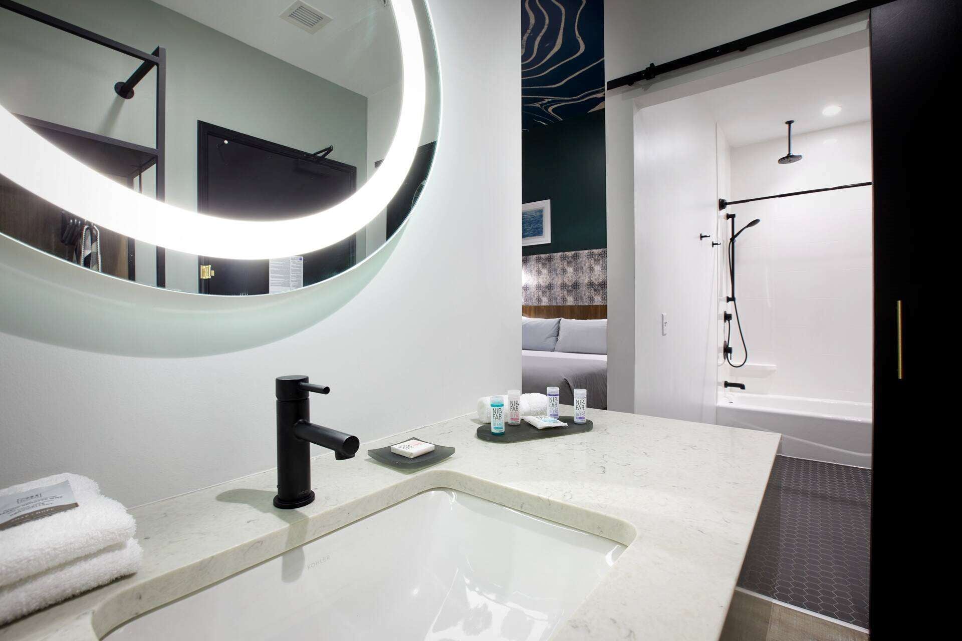 designer toiletries, hair dryer, towels, soap