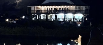Majestic bayfront home. 450’ pier w/ boat access, crabbing, fishing, & swimming.