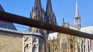 A Gothic-style cathedral with pointed spires and intricate stonework.
