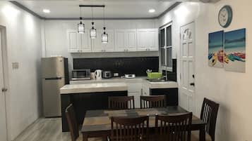 Fridge, microwave, stovetop, cookware/dishes/utensils