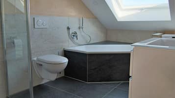 Bathtub, hair dryer, towels, soap