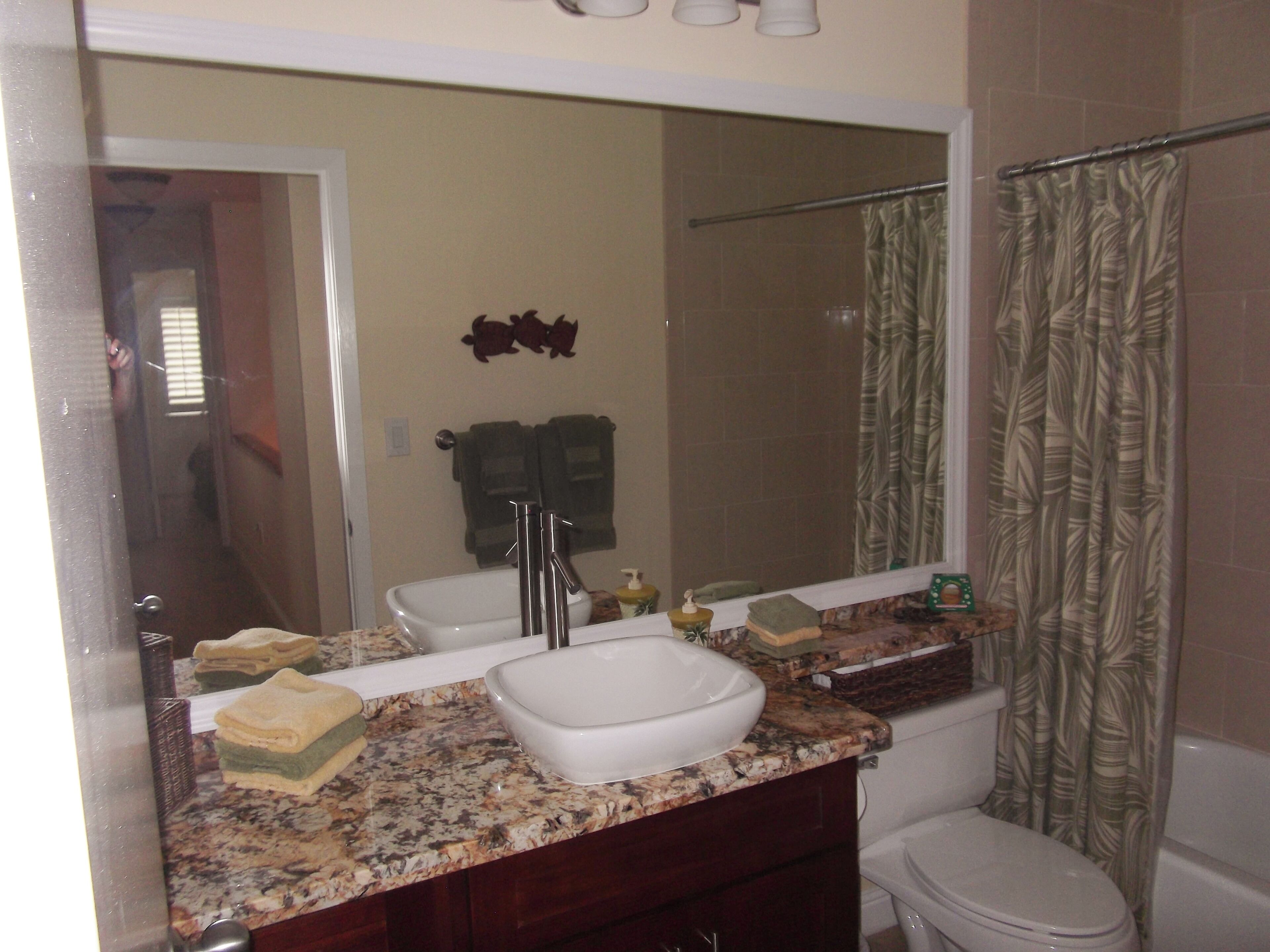 Combined shower/tub, hair dryer, towels, soap