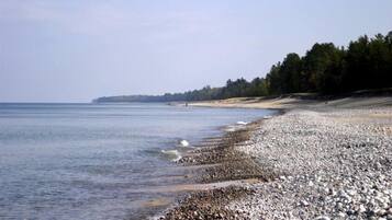 On the beach, sun loungers, beach towels
