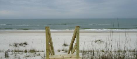 On the beach, sun-loungers