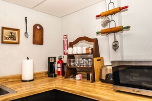 Fridge, microwave, stovetop, coffee/tea maker