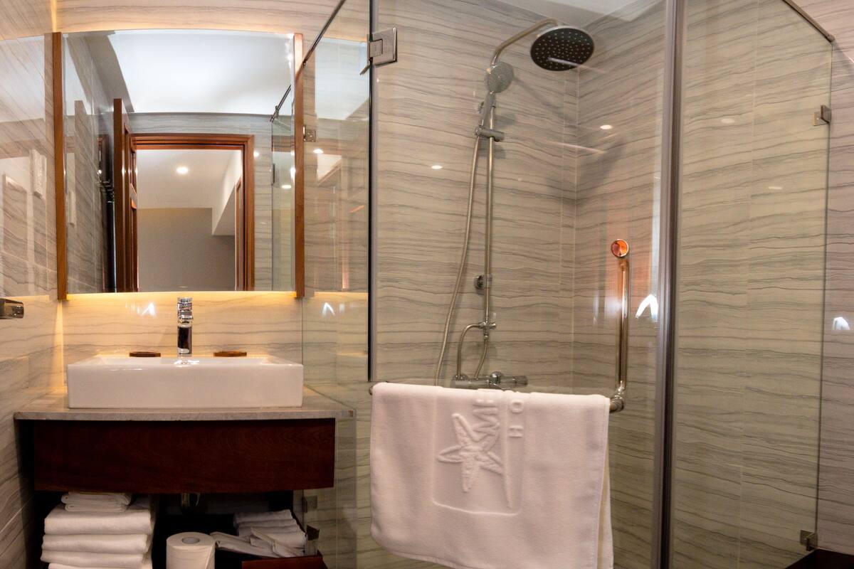 deluxe twin room | bathroom | shower, designer toiletries, hair dryer, bathrobes