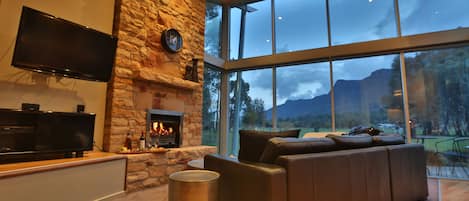 Luxury Chalet, 1 King Bed, Mountain View | Living area | Flat-screen TV, DVD player