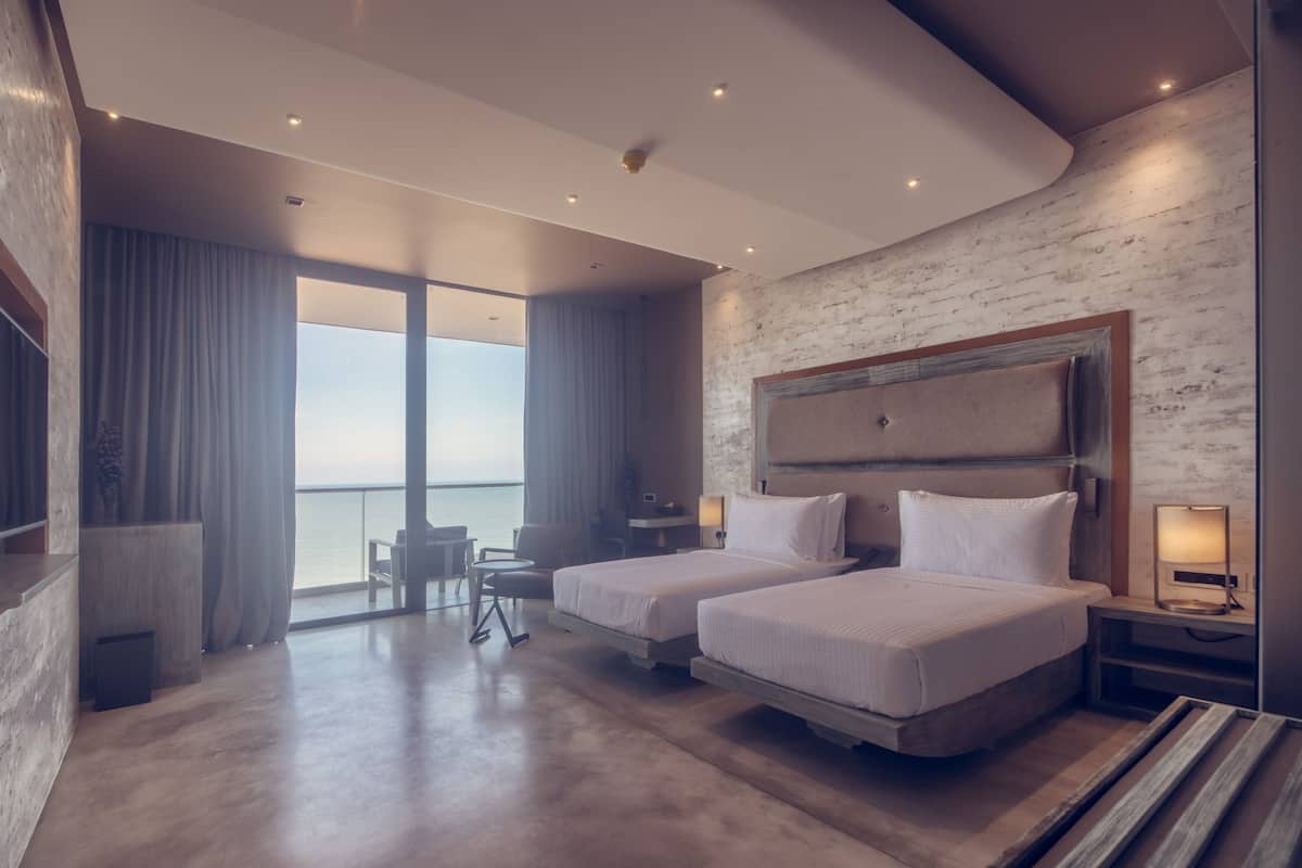 Deluxe Twin Room, 1 Bedroom, Beach View | Premium bedding, minibar, in-room safe, individually decorated