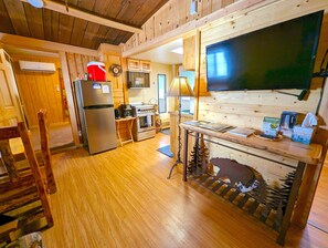 Comfort Cabin, 1 Bedroom | Living area | Flat-screen TV - Yellowstone's Treasure Cabins (Gardiner)