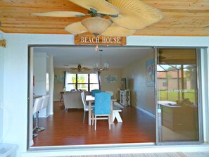 Enjoy meals in the dining area with a clear view through the glass door.