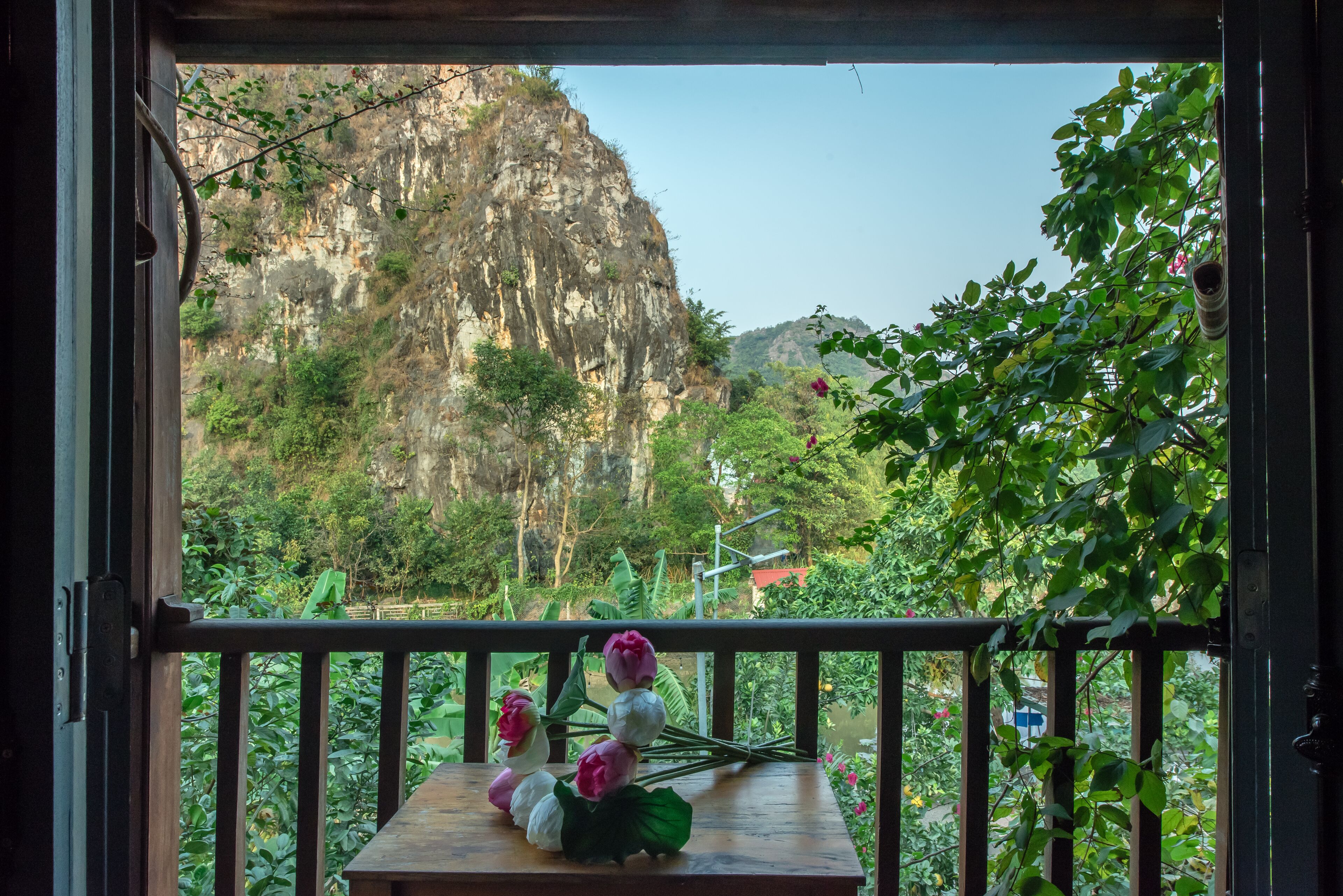 A balcony with a view of a mountainous landscape.
