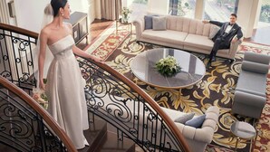 A spacious lobby with a grand staircase, a large sofa, and a city view. - Sheraton Hai Phong (Hai Phong)