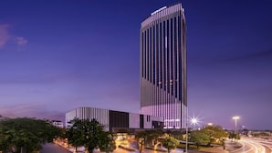 A modern hotel with a tall, rectangular building and a shorter structure with vertical lines. - Sheraton Hai Phong (Hai Phong)
