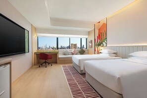 A hotel room with a city view, a desk, two beds, and a TV. - Atwell Suites Shanghai Wuning by IHG (Shanghai)