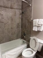 Combined shower/tub, rainfall showerhead, towels, soap