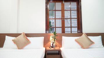 Deluxe Quadruple Room, 2 Double Beds | Minibar, desk, blackout curtains, soundproofing