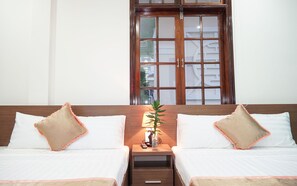 Deluxe Quadruple Room, 2 Double Beds | Minibar, desk, blackout drapes, soundproofing - Hung Long Hostel (Hue)
