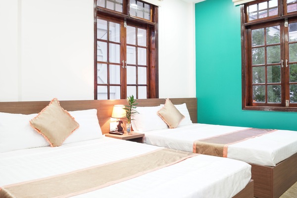Deluxe Quadruple Room, 2 Double Beds | Minibar, desk, blackout curtains, soundproofing