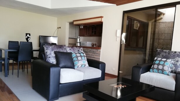 Deluxe House, Multiple Beds, Accessible, Non Smoking | Living area | 32-inch LED TV with digital channels, TV, fireplace - Casa Moderna de Lujo (Cochabamba)