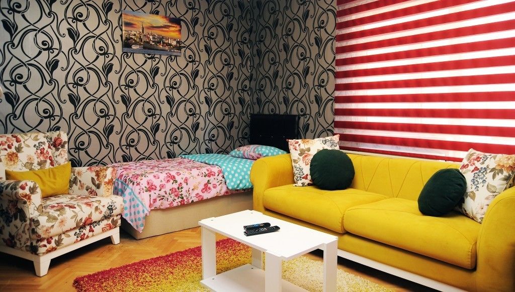 Apartamento familiar, fumadores, vistas a la ciudad | Zona de estar | Una televisión LCD